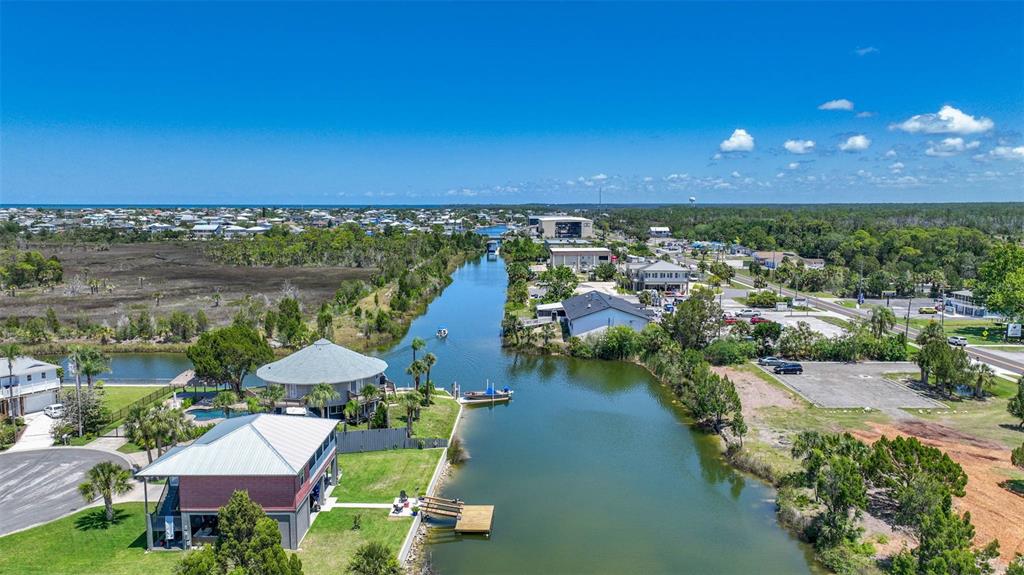 3404 Fernleaf Drive Hernando Beach, FL 34607 - Photo 10 of 11 a view of a city with lawn chairs under an umbrella