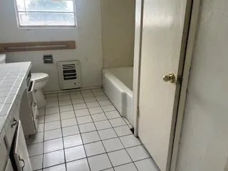 a view of a bathroom from a hallway