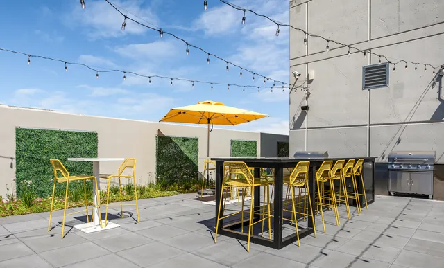 a view of a swimming pool with a patio and a tub