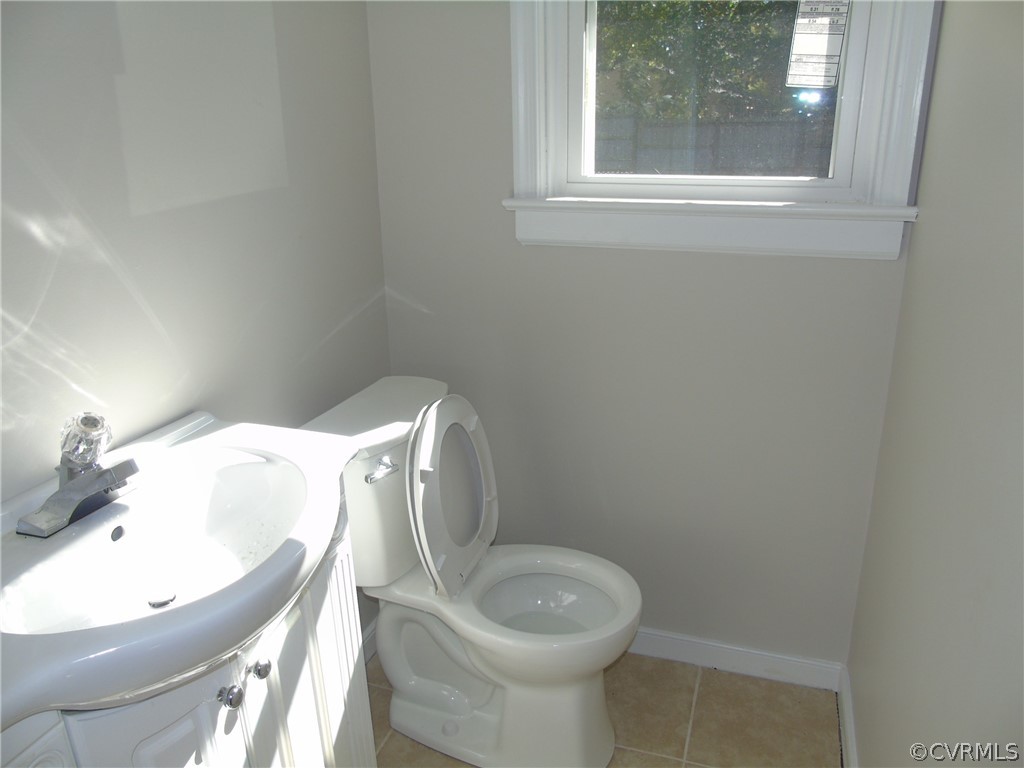 9901 Qualla Road Chesterfield, VA 23832 - Photo 18 of 38 1/2 bath with new ceramic tile floor, New toilet.