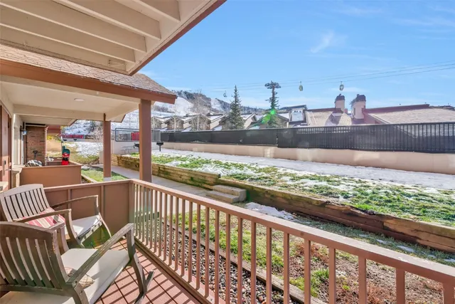 a view of a house with wooden fence
