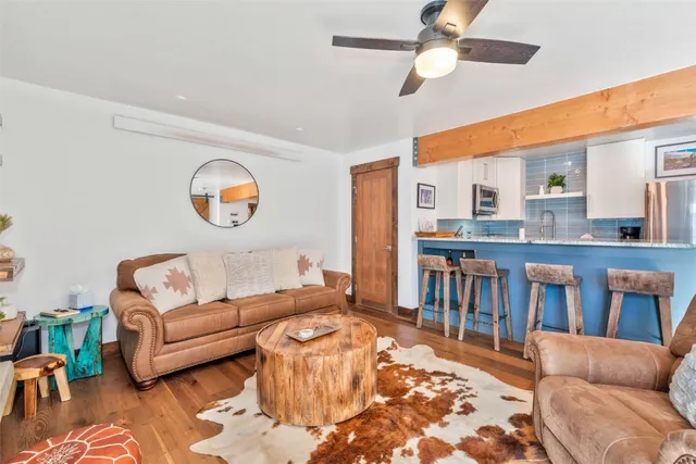 a living room with furniture and a rug