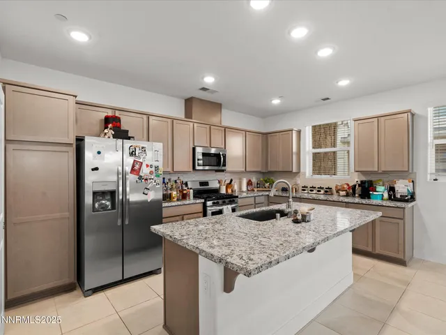 a kitchen with counter top space cabinets and appliances