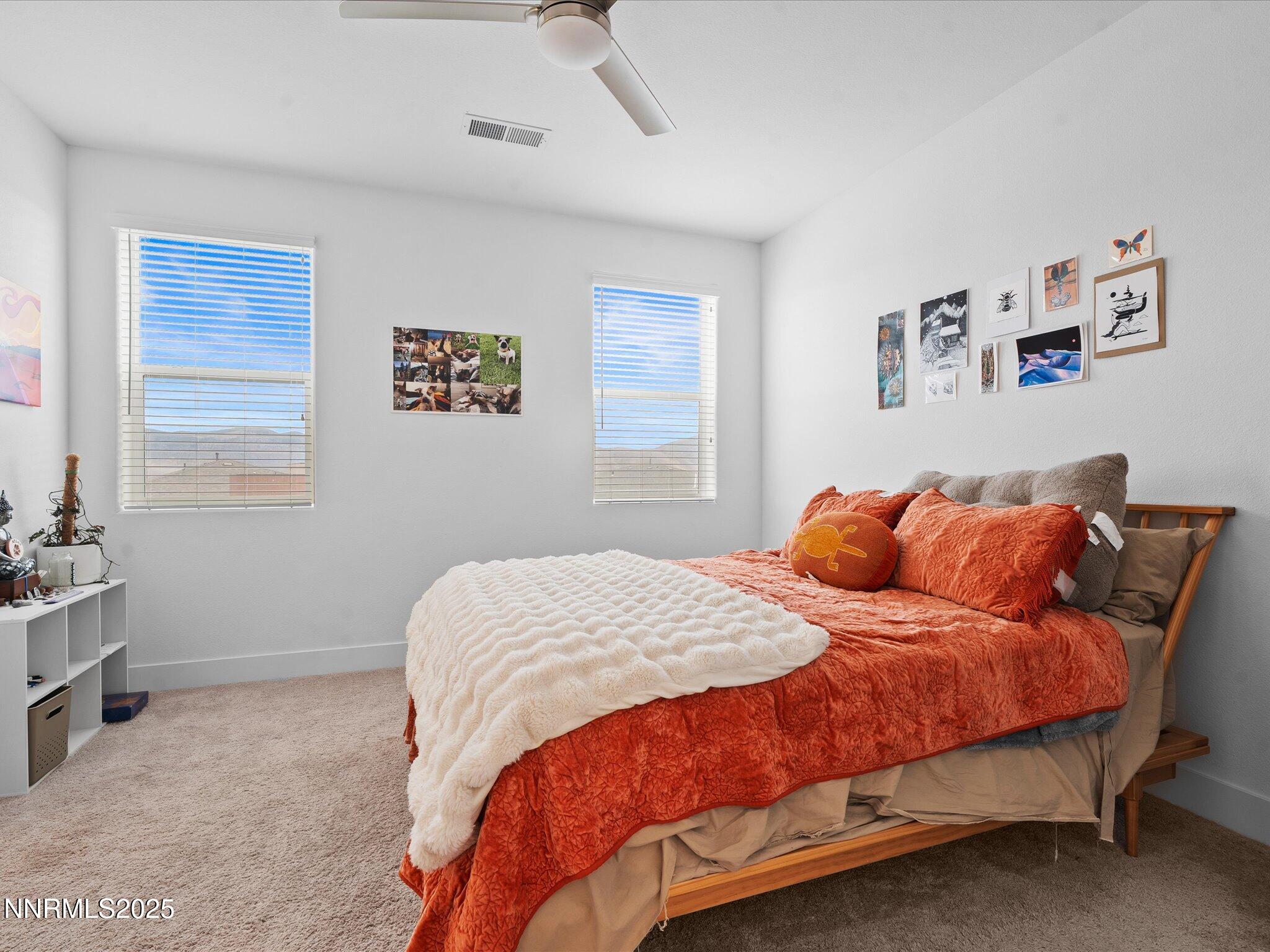 3621 Pulsar Lane, Unit 2 Carson City, NV 89705 - Photo 20 of 31 a bedroom with a bed and window