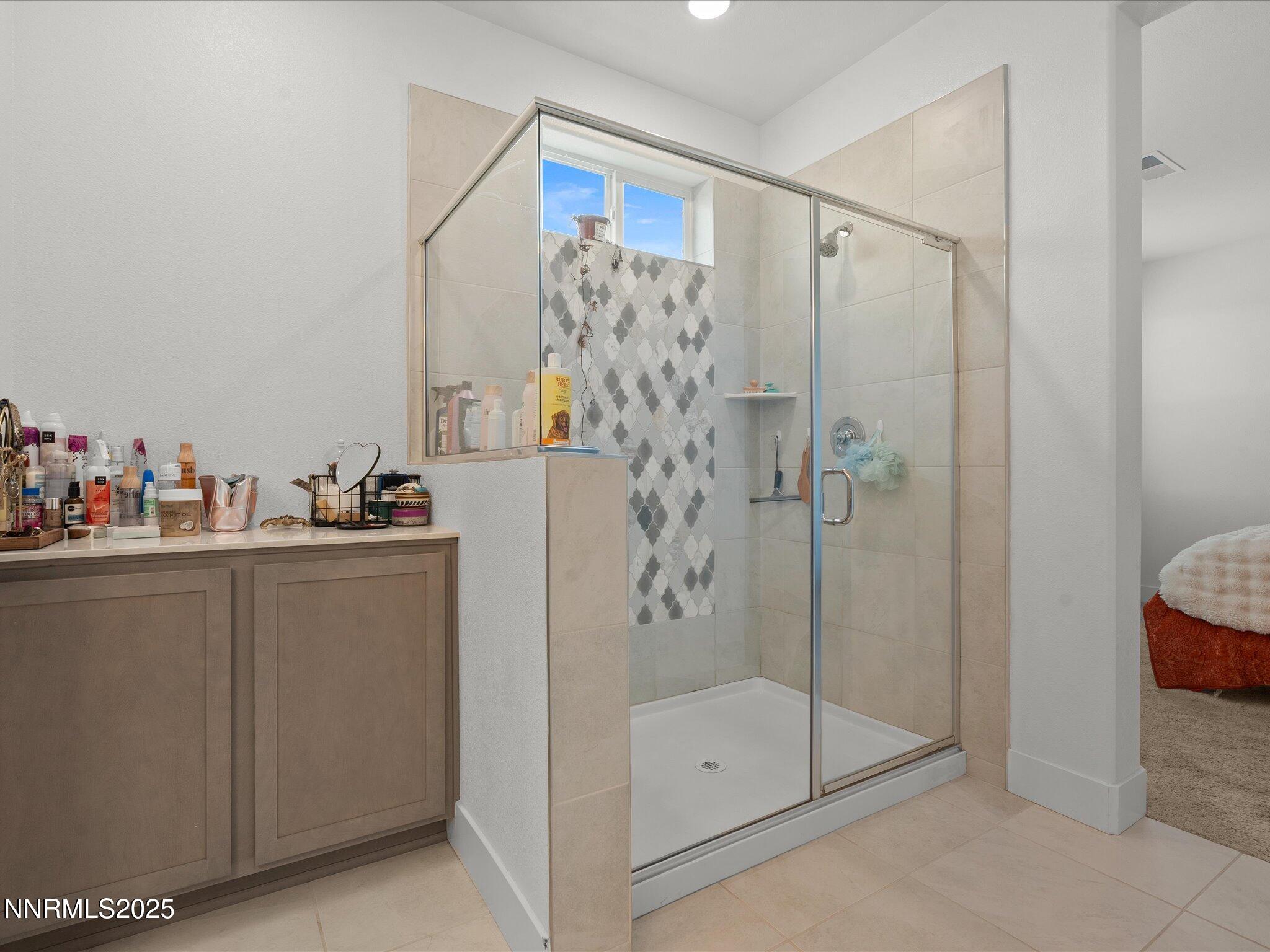 3621 Pulsar Lane, Unit 2 Carson City, NV 89705 - Photo 23 of 31 a bathroom with a shower and a sink