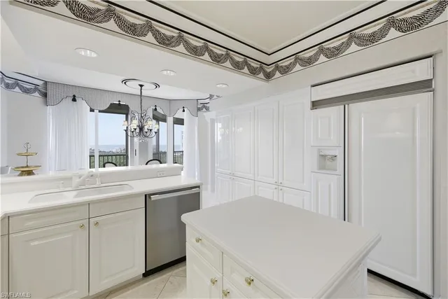 a spacious bathroom with a toilet a sink and mirror