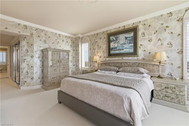 a view of a dining room with furniture large windows and wooden floor