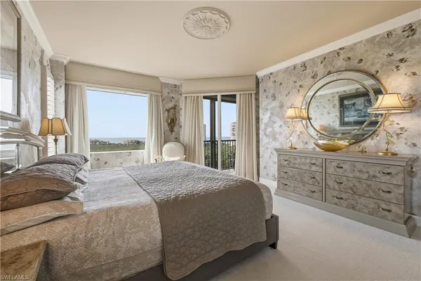 a bedroom with bed and window