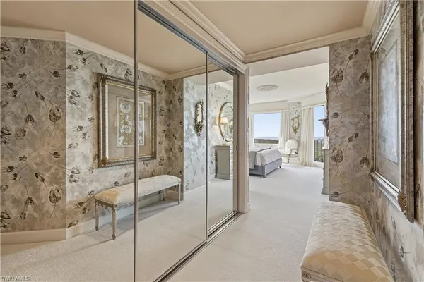 a bathroom with a tub shower and mirror