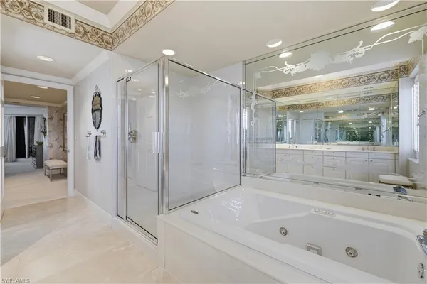 a bathroom with a bathtub shower and a sink