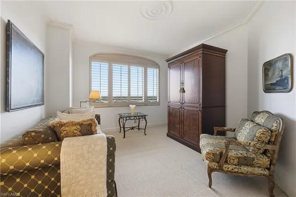 a spacious bedroom with a bed and furniture
