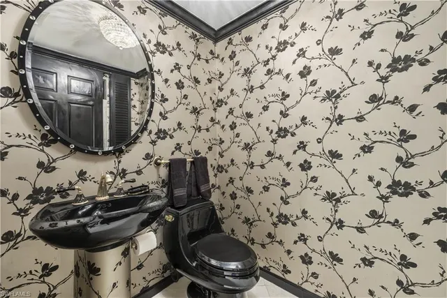a kitchen with a sink a stove and cabinets