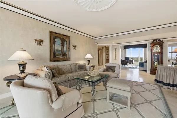 a living room with furniture and a lamp