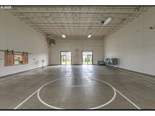a kitchen with kitchen island a sink stove and refrigerator