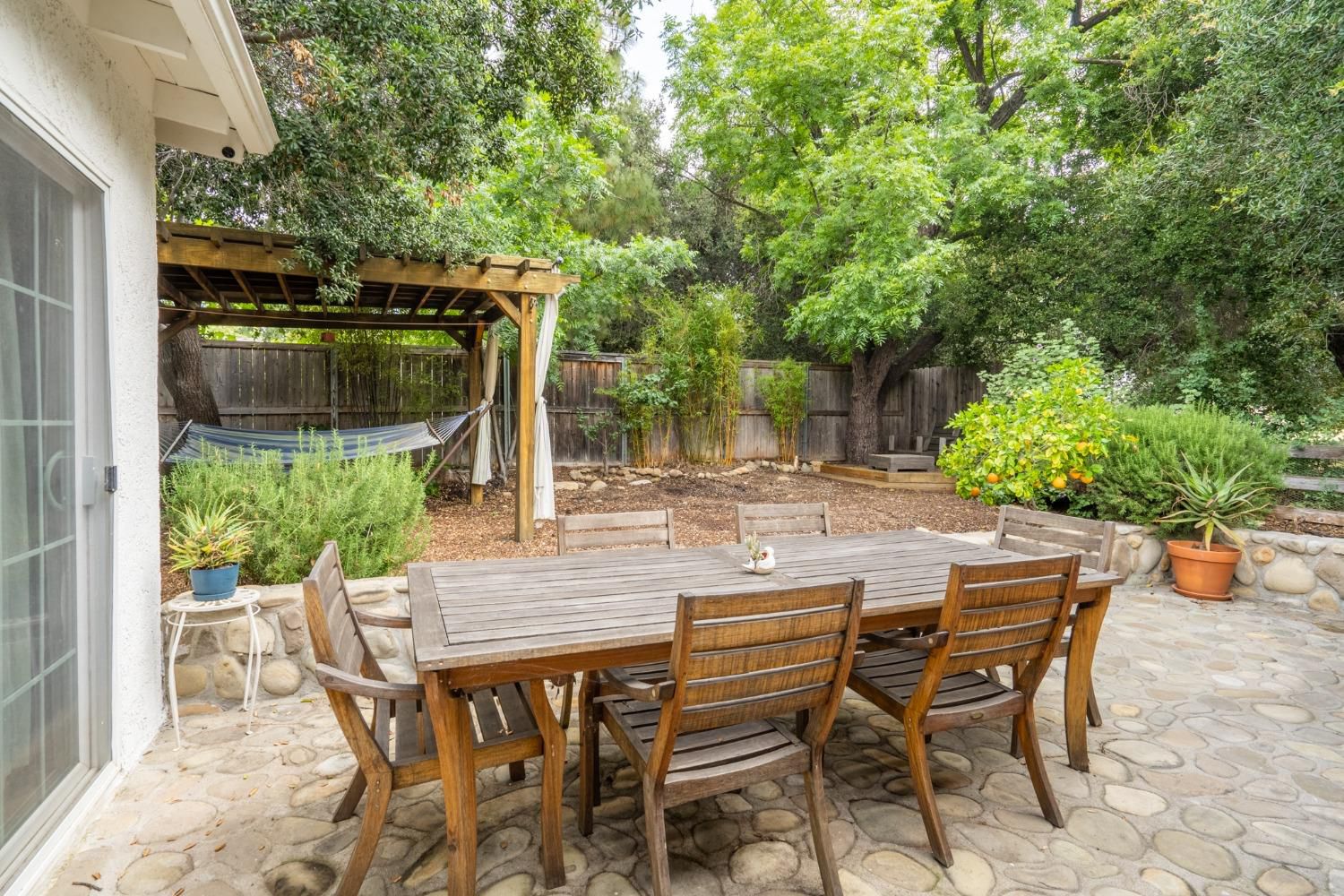 412 Franklin Drive Ojai, CA 93023 - Photo 25 of 50 a view of patio with table and chairs and potted plants