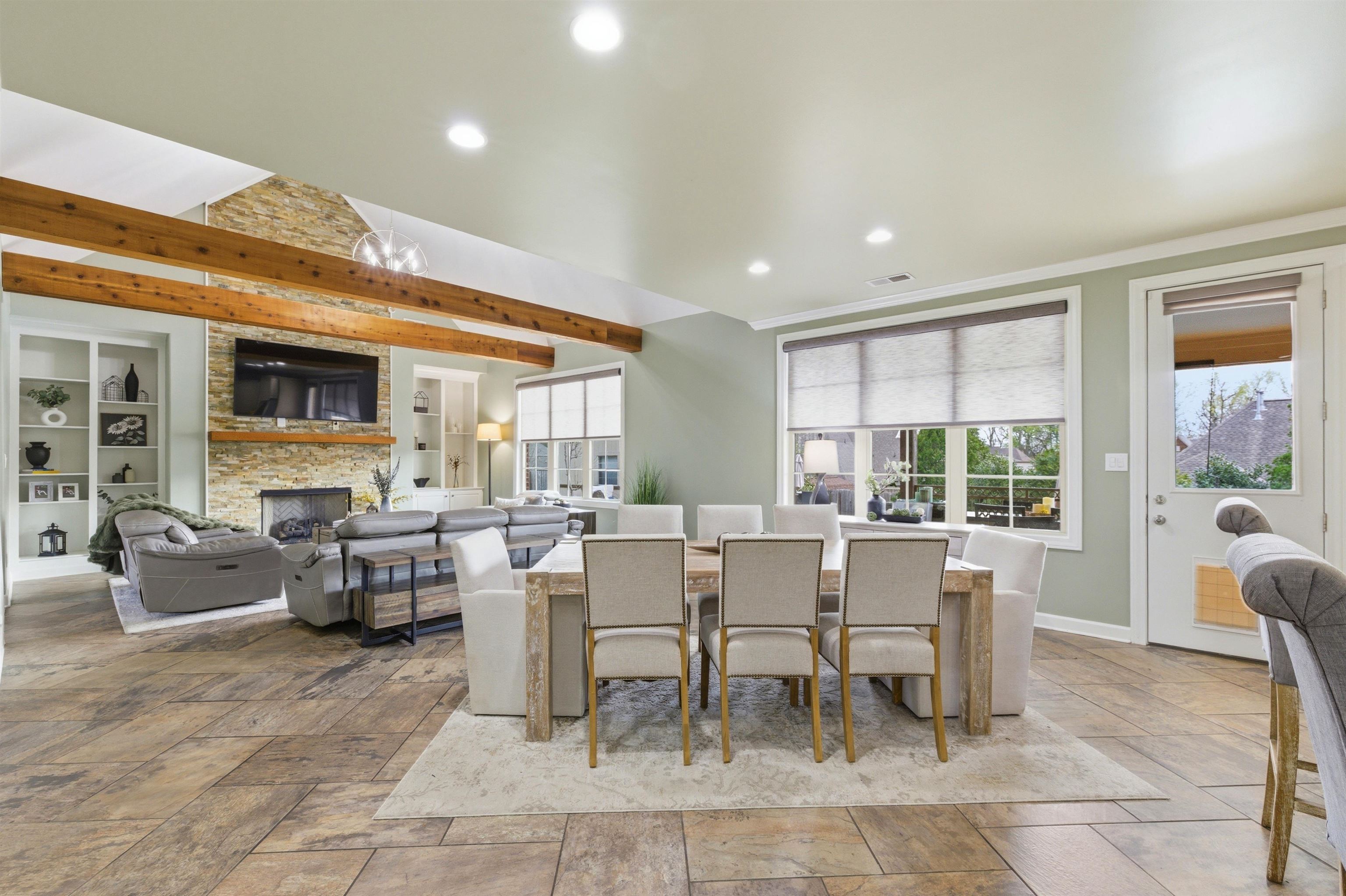 5956 Windsor Falls Loop Arlington, TN 38002 - Photo 13 of 40 a dining room with wooden floor and glass windows