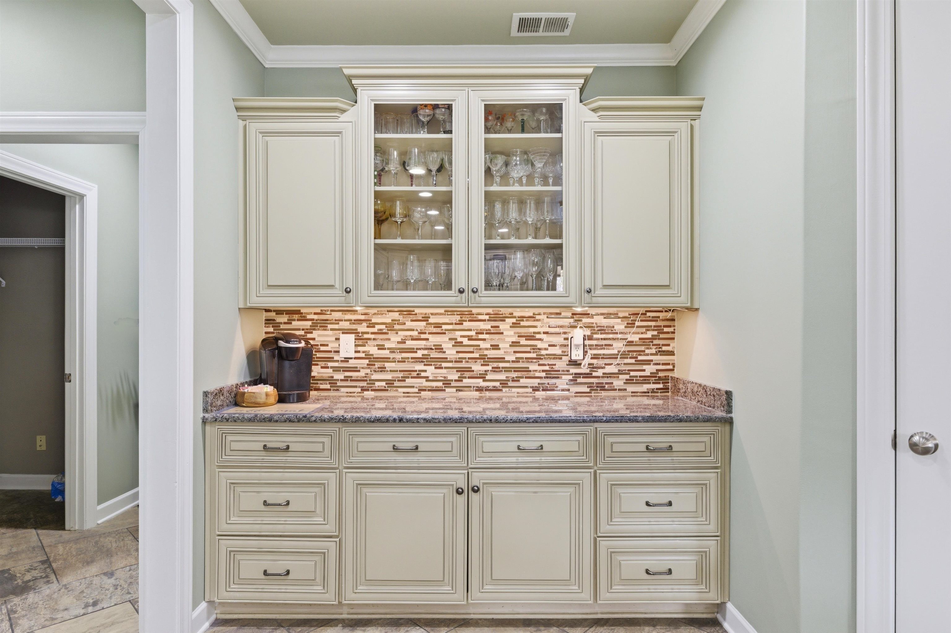 5956 Windsor Falls Loop Arlington, TN 38002 - Photo 16 of 40 a view of granite countertop white cabinets and window