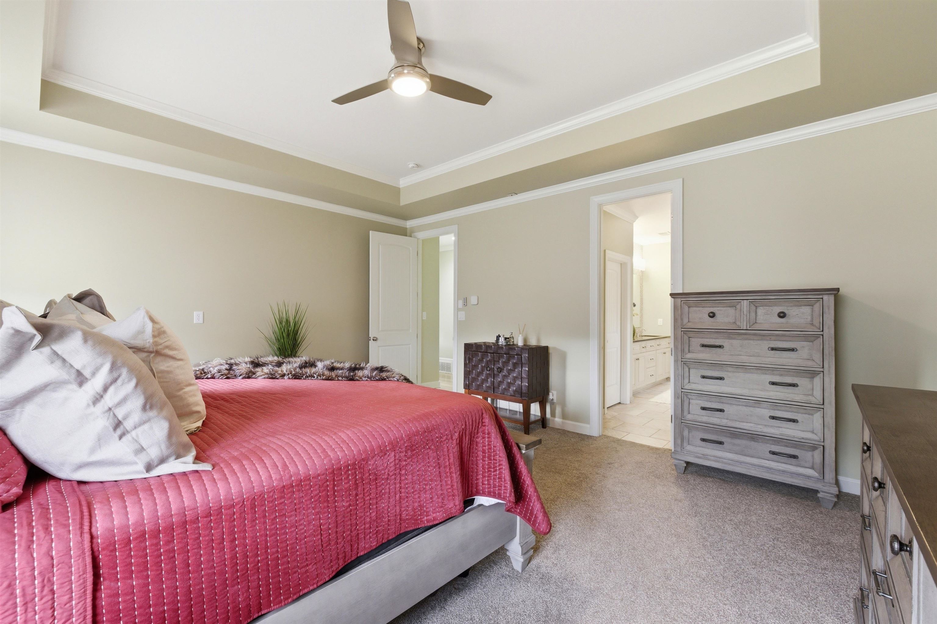 5956 Windsor Falls Loop Arlington, TN 38002 - Photo 19 of 40 a bedroom with a bed and a chandelier