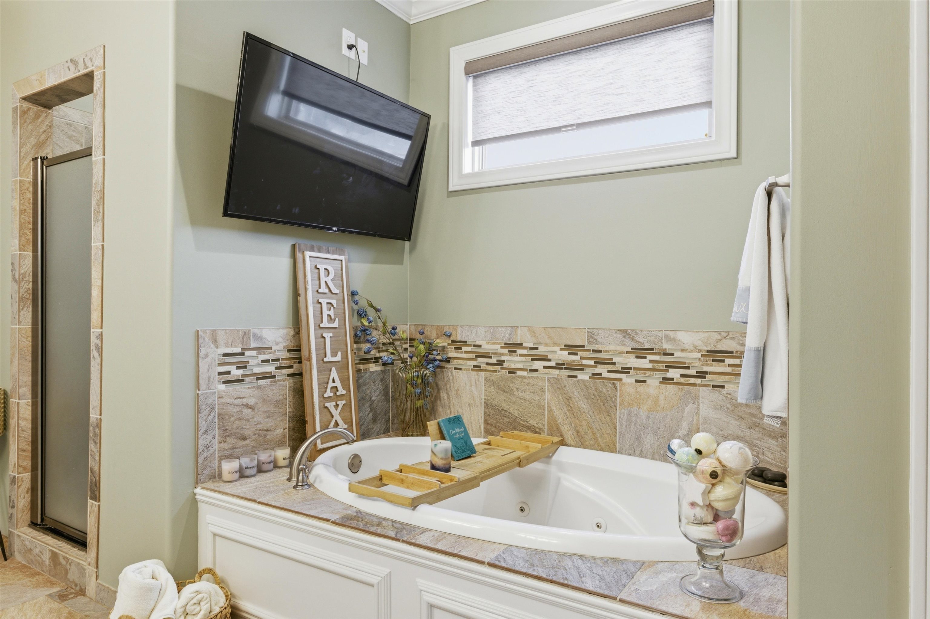 5956 Windsor Falls Loop Arlington, TN 38002 - Photo 20 of 40 a bathroom with a granite countertop sink and a mirror