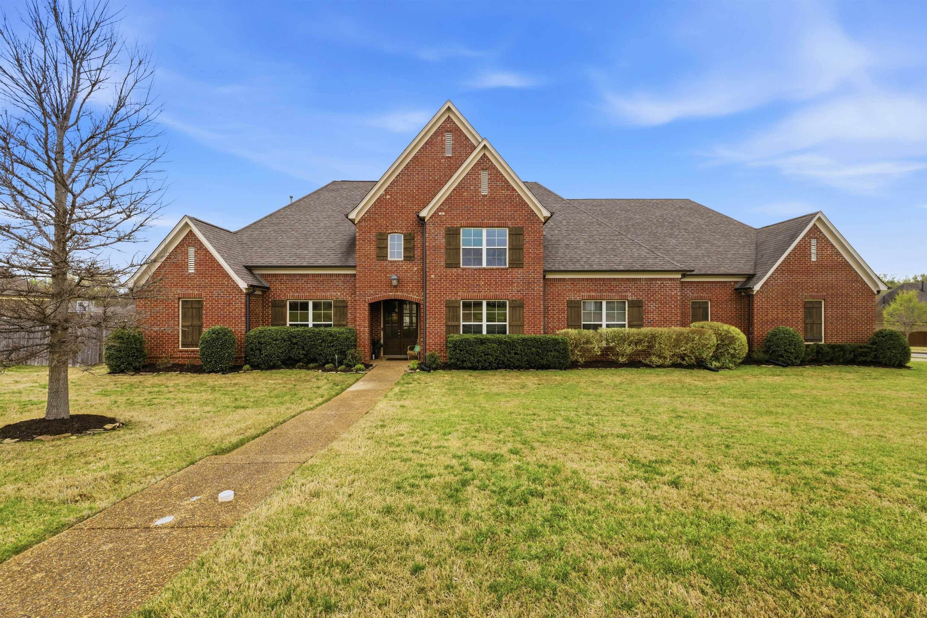 5956 Windsor Falls Loop Arlington, TN 38002 - Photo 2 of 40 a front view of a house with a yard