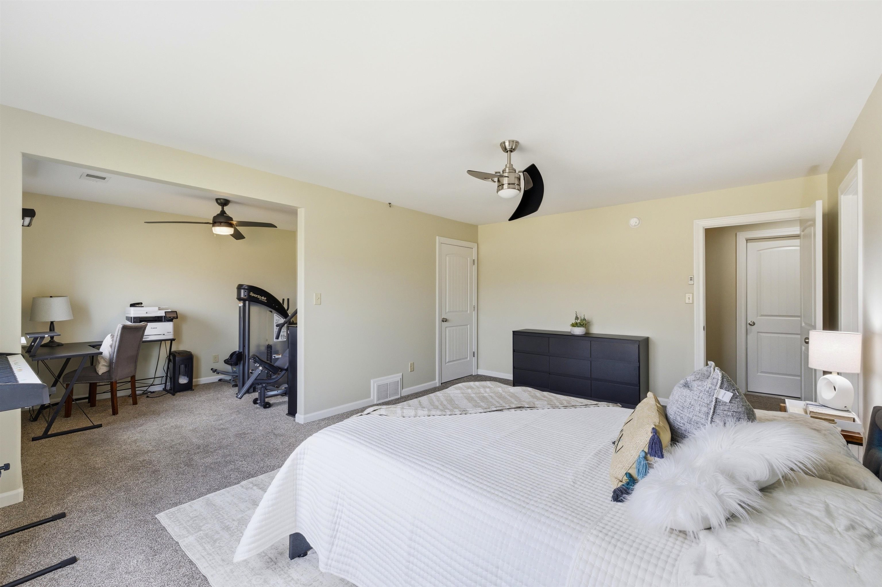 5956 Windsor Falls Loop Arlington, TN 38002 - Photo 28 of 40 a bedroom with a bed and a chair