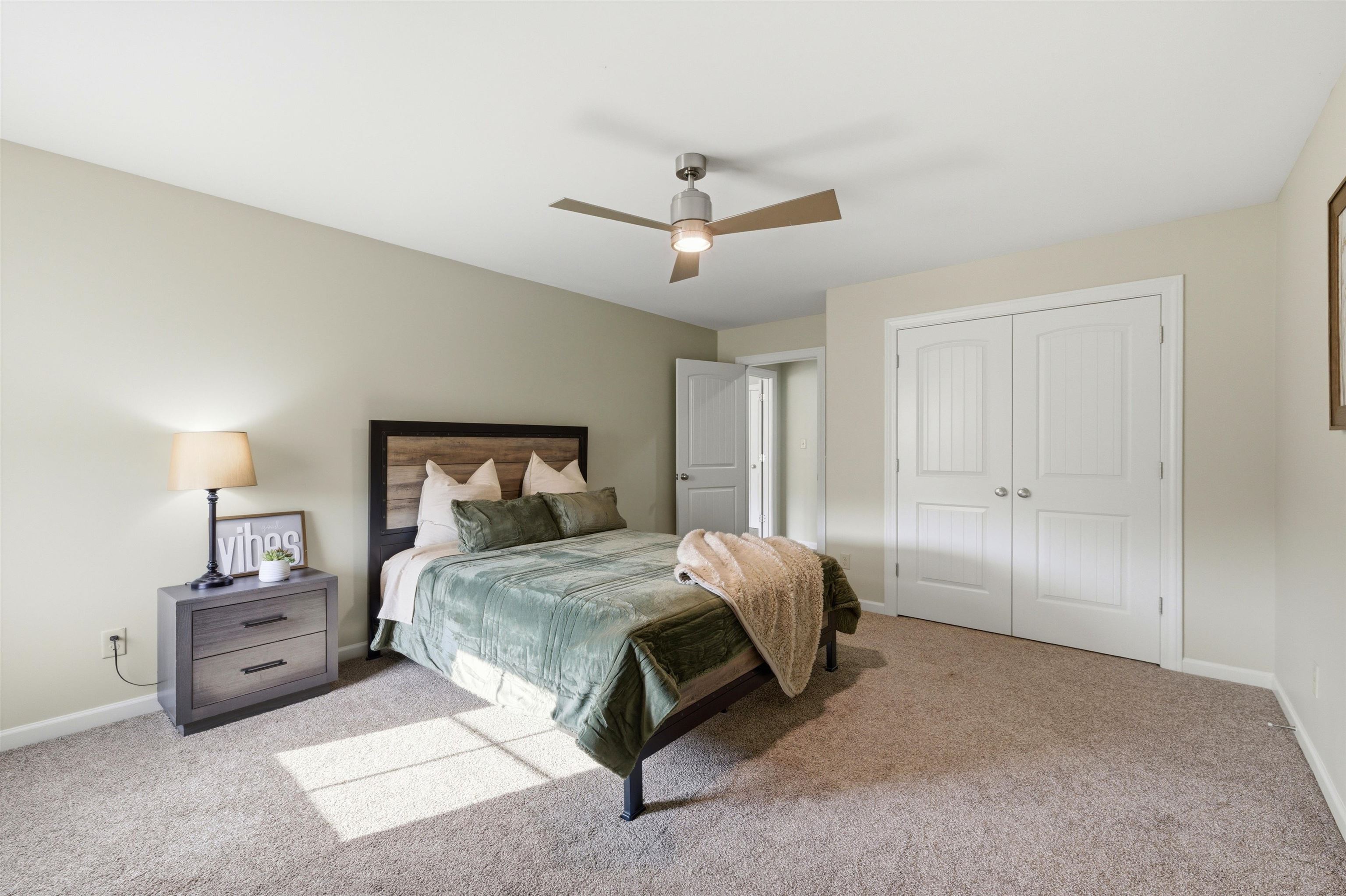 5956 Windsor Falls Loop Arlington, TN 38002 - Photo 29 of 40 a bedroom with a bed and a ceiling fan