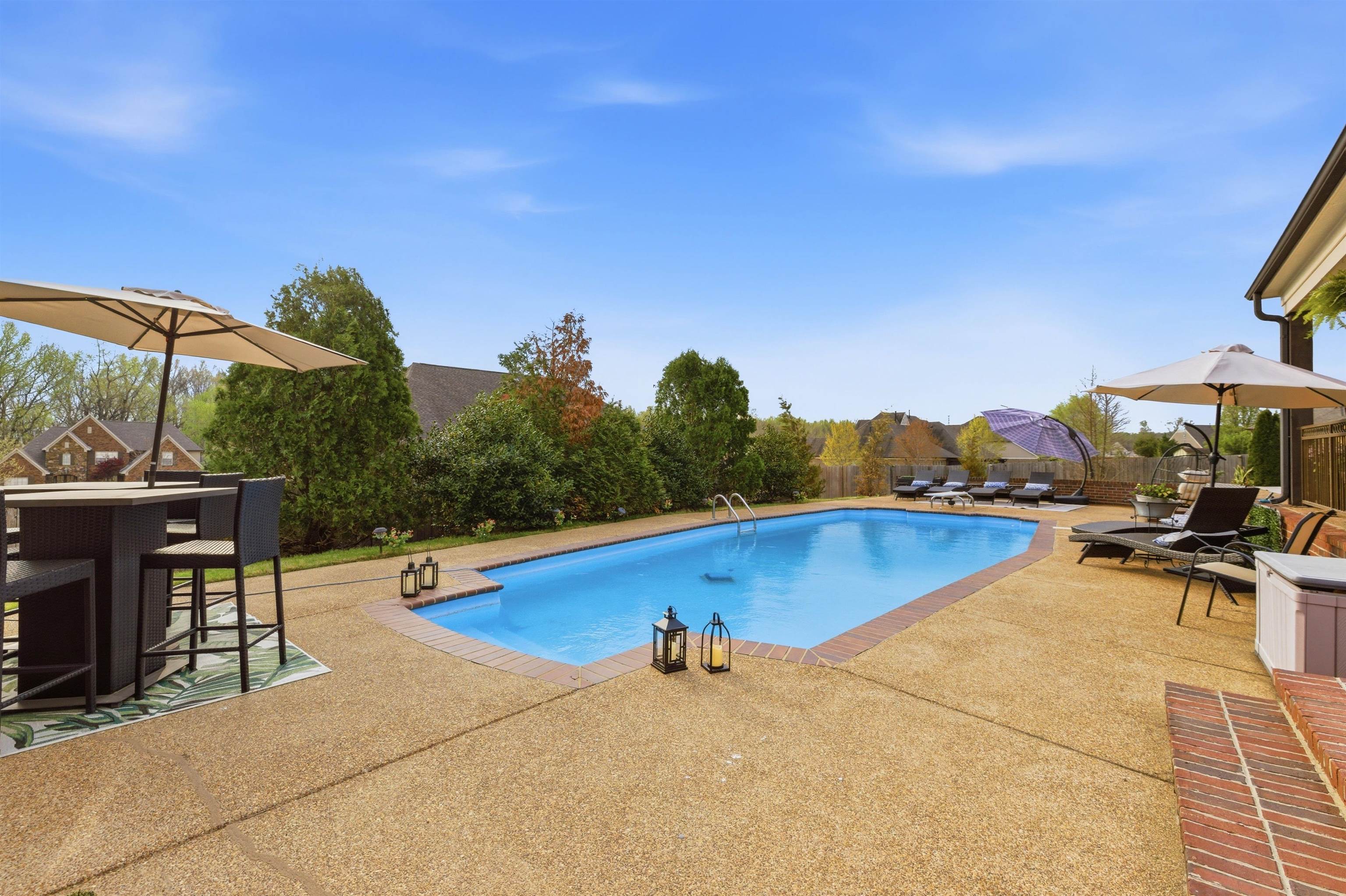 5956 Windsor Falls Loop Arlington, TN 38002 - Photo 31 of 40 a view of a swimming pool and lounge chairs