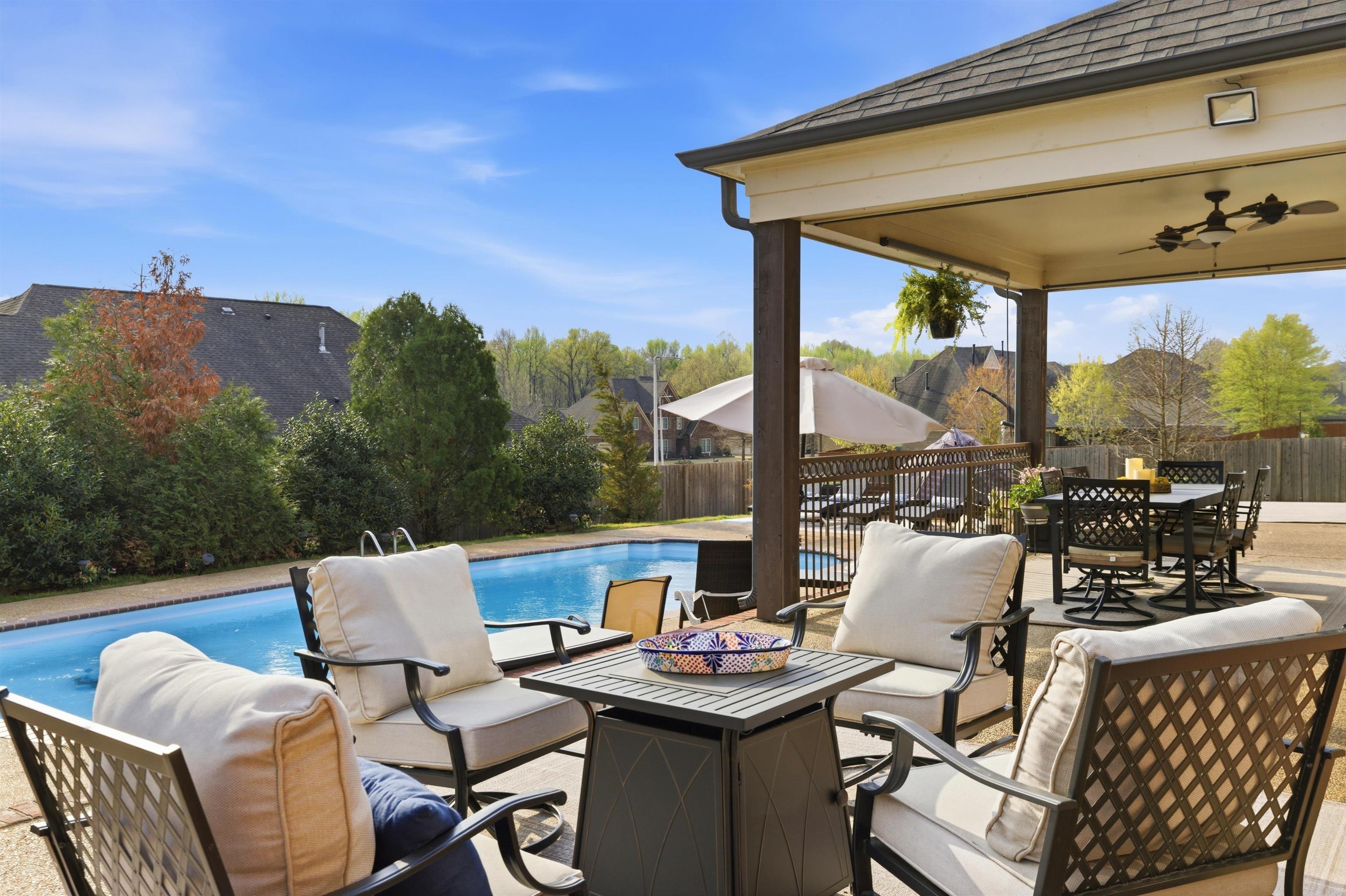 5956 Windsor Falls Loop Arlington, TN 38002 - Photo 32 of 40 a view of a patio with a table chairs and a table