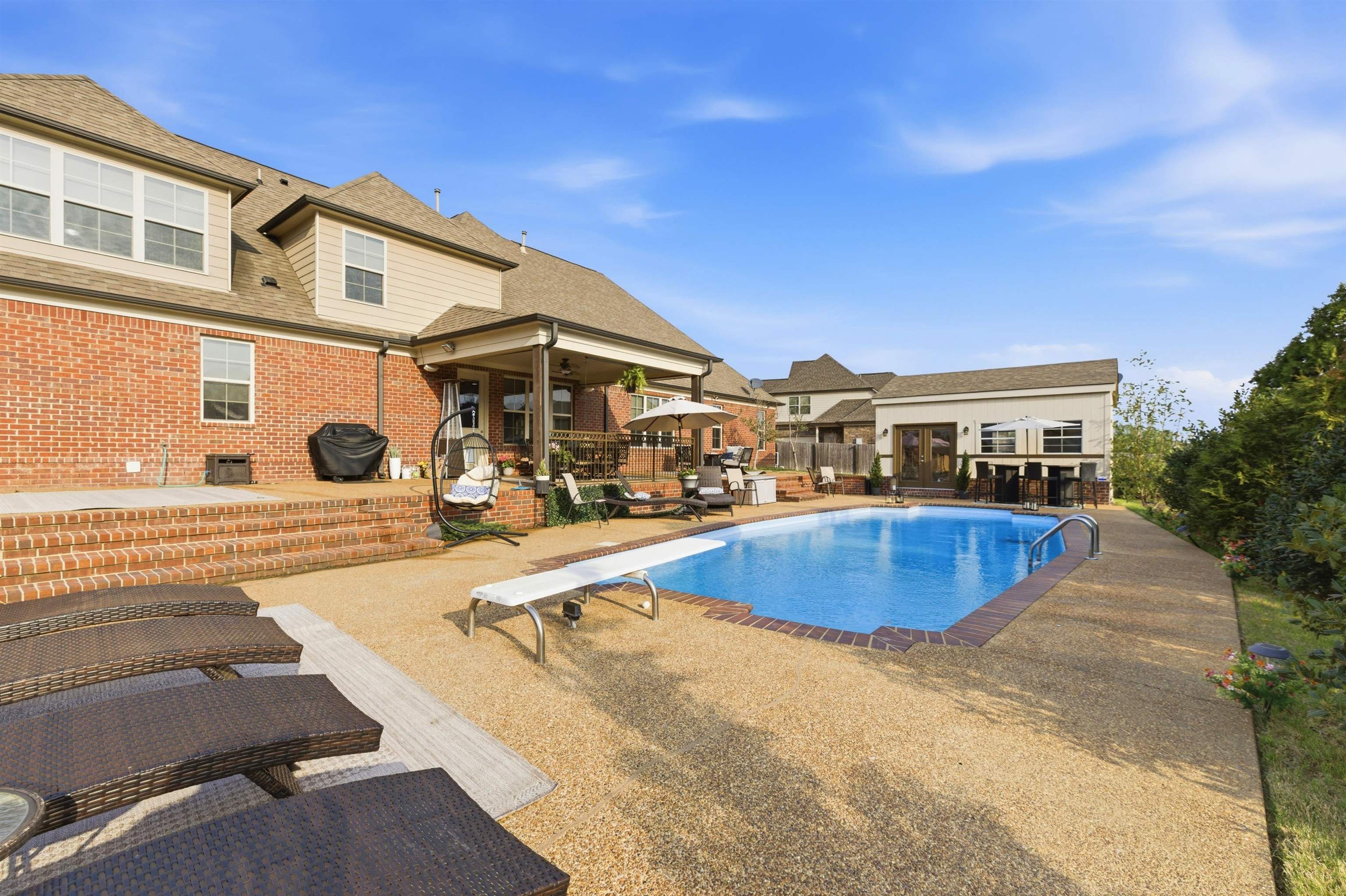 5956 Windsor Falls Loop Arlington, TN 38002 - Photo 38 of 40 a view of a house with swimming pool and sitting area