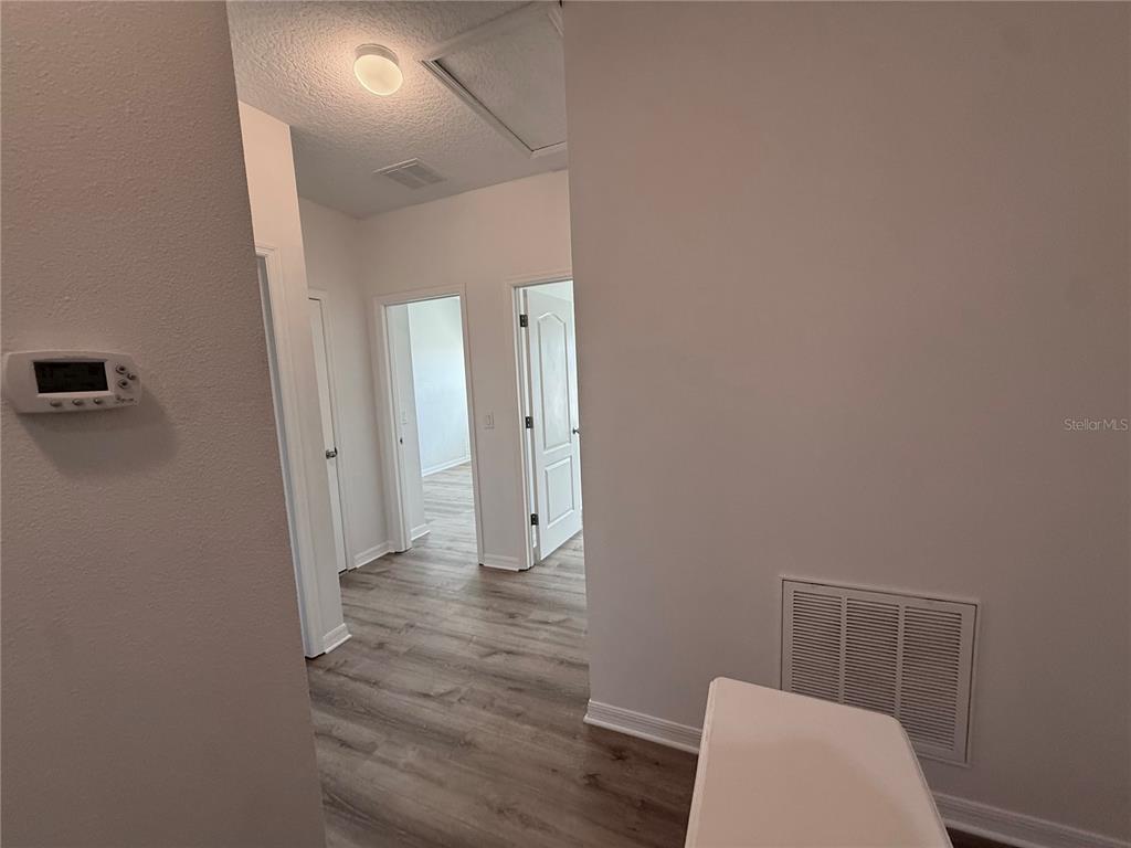 7605 Ripplepointe Way Windermere, FL 34786 - Photo 11 of 27 a view of room with wooden floor