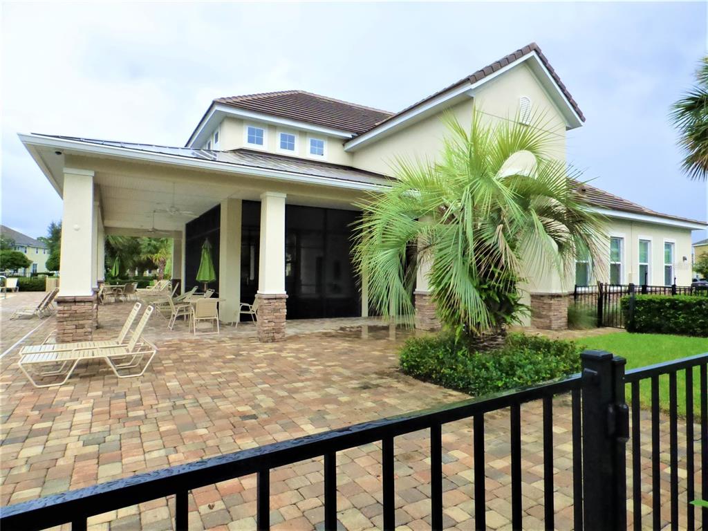 7605 Ripplepointe Way Windermere, FL 34786 - Photo 24 of 27 a view of an house with backyard porch and patio