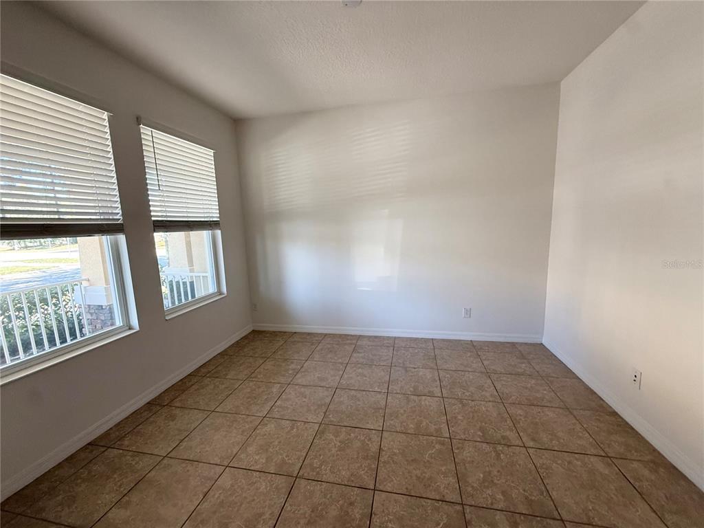 7605 Ripplepointe Way Windermere, FL 34786 - Photo 3 of 27 an empty room with windows