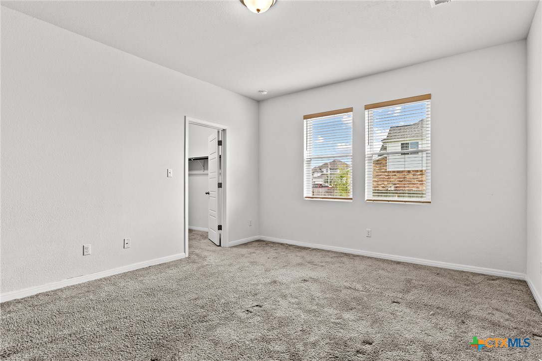 448 Chaste Tree Drive San Marcos, TX 78666 - Photo 21 of 31 an empty room with a window
