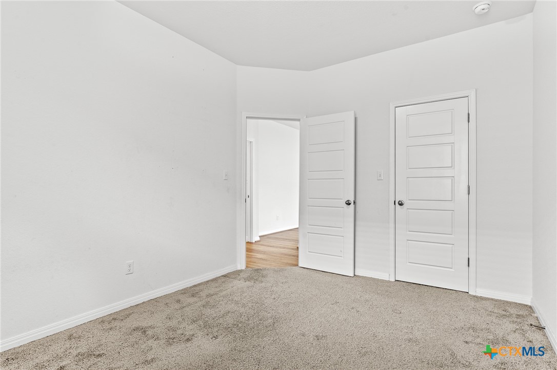 448 Chaste Tree Drive San Marcos, TX 78666 - Photo 25 of 31 an empty room with closet area