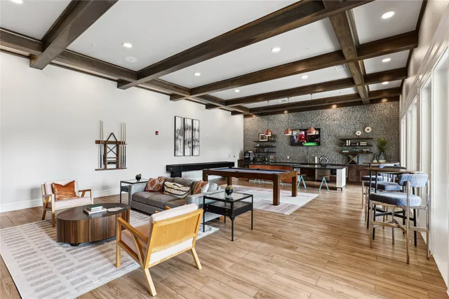 a living room with lots of furniture and wooden floors