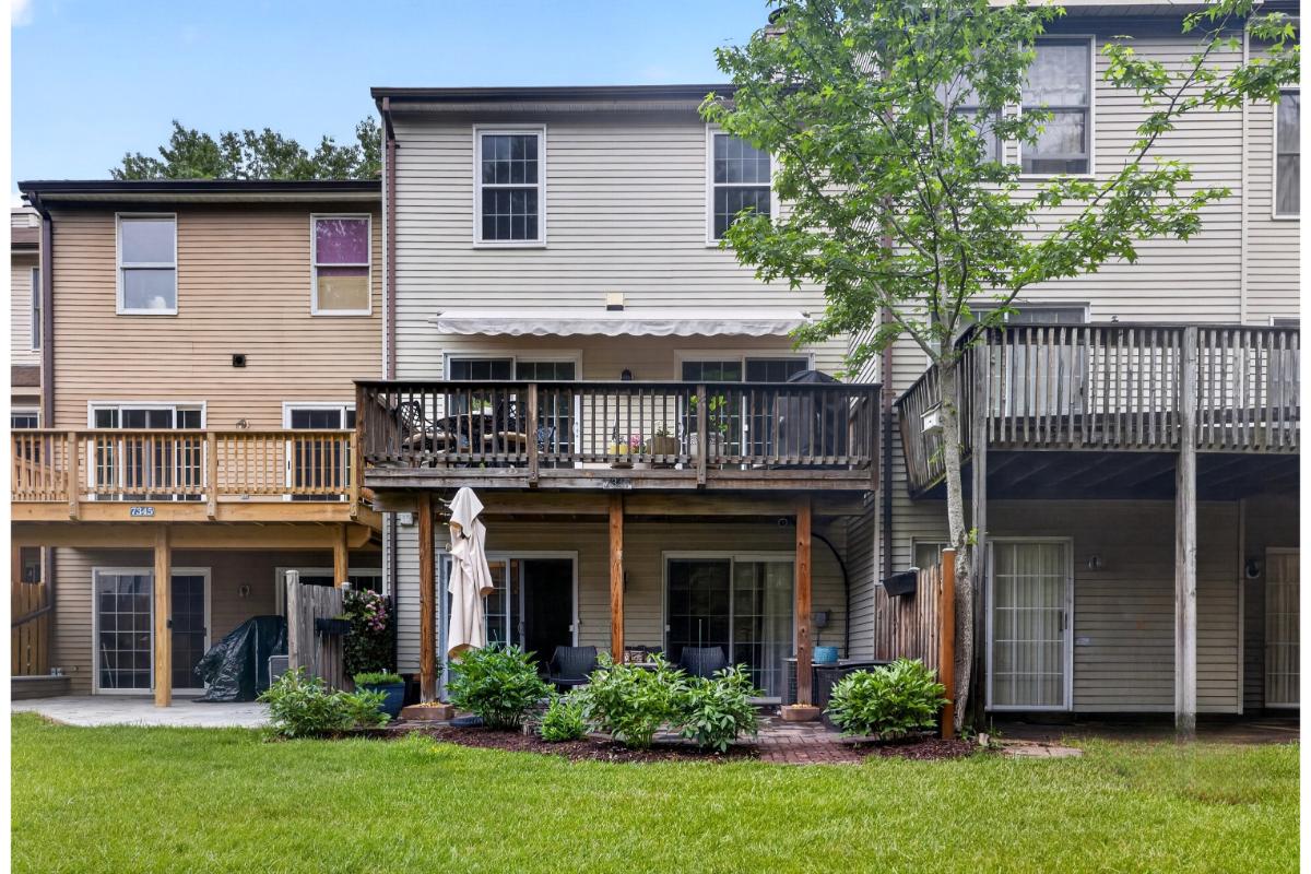 7347 Swan Point Way, Unit 122 Columbia, MD 21045 - Photo 42 of 54 a front view of a house with porch and garden