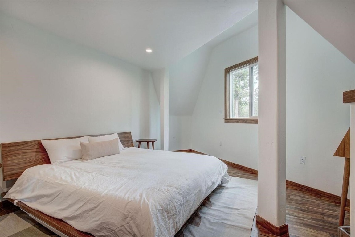 53 Blue Ridge Road Breckenridge, CO 80424 - Photo 15 of 30 Bedroom featuring lofted ceiling and hardwood floors