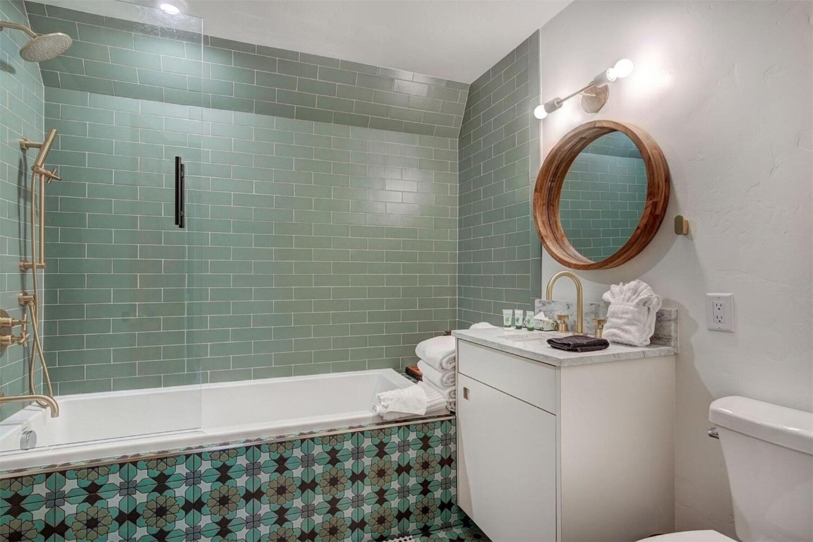 53 Blue Ridge Road Breckenridge, CO 80424 - Photo 20 of 30 Primary Full bathroom featuring tiled shower / bath combo, vanity, and toilet