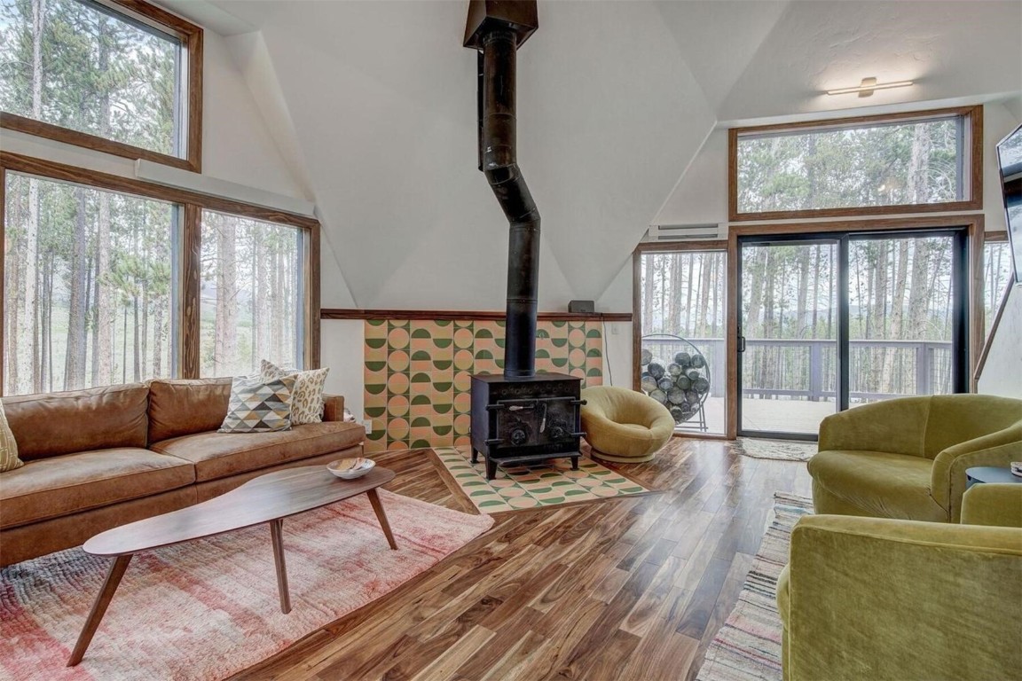 53 Blue Ridge Road Breckenridge, CO 80424 - Photo 10 of 30 Sunny Living room with a wood stove, and high vaulted ceiling