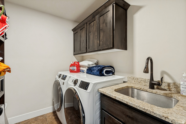 40 Wheeler Road Heber City, UT 84032 - Photo 11 of 41 Built-in cabinetry, under-mount sink, granite countertop, wall-mounted faucet, and wood-finish flooring