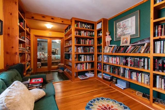 a view of workspace with furniture and wooden floor