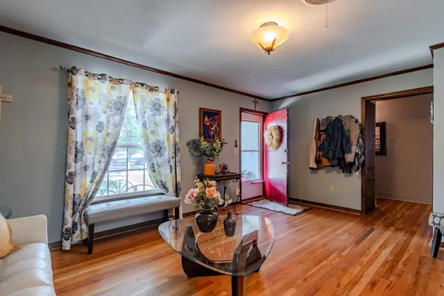 a living room with furniture and a window