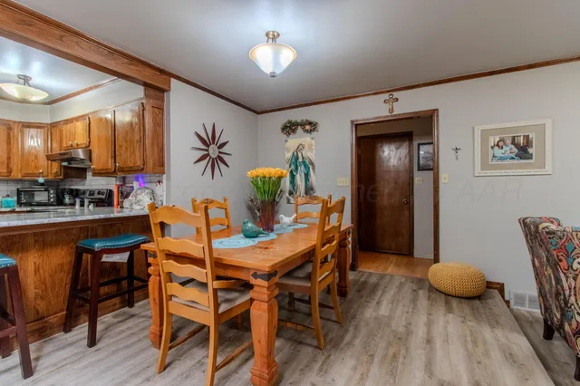 a dining room with furniture and window