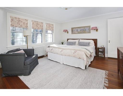 121 Intervale Road Newton, MA 02467 - Photo 9 of 14 a spacious bedroom with a large bed couch and a large window