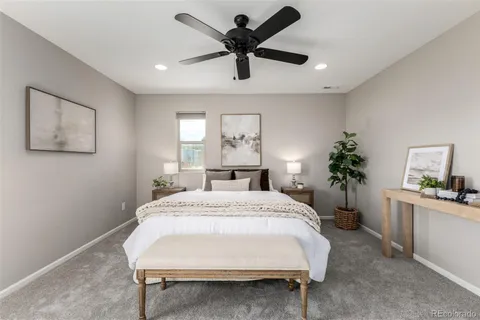 a bed room with a bed and a chandelier