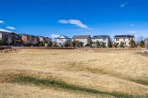 a view of a building with a yard