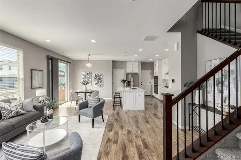 a view of a living room and dining room
