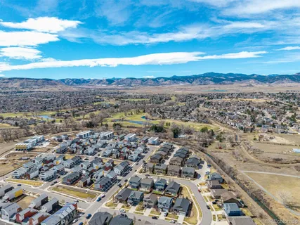an aerial view of residential building and ocean view