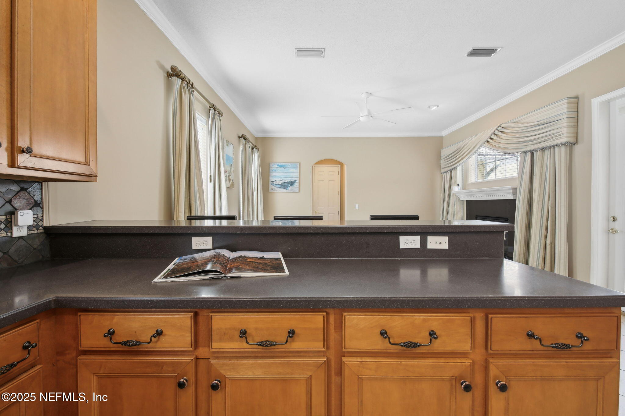400 Central Street St. Augustine, FL 32095 - Photo 14 of 49 a kitchen with granite countertop a stove a sink and a cabinets
