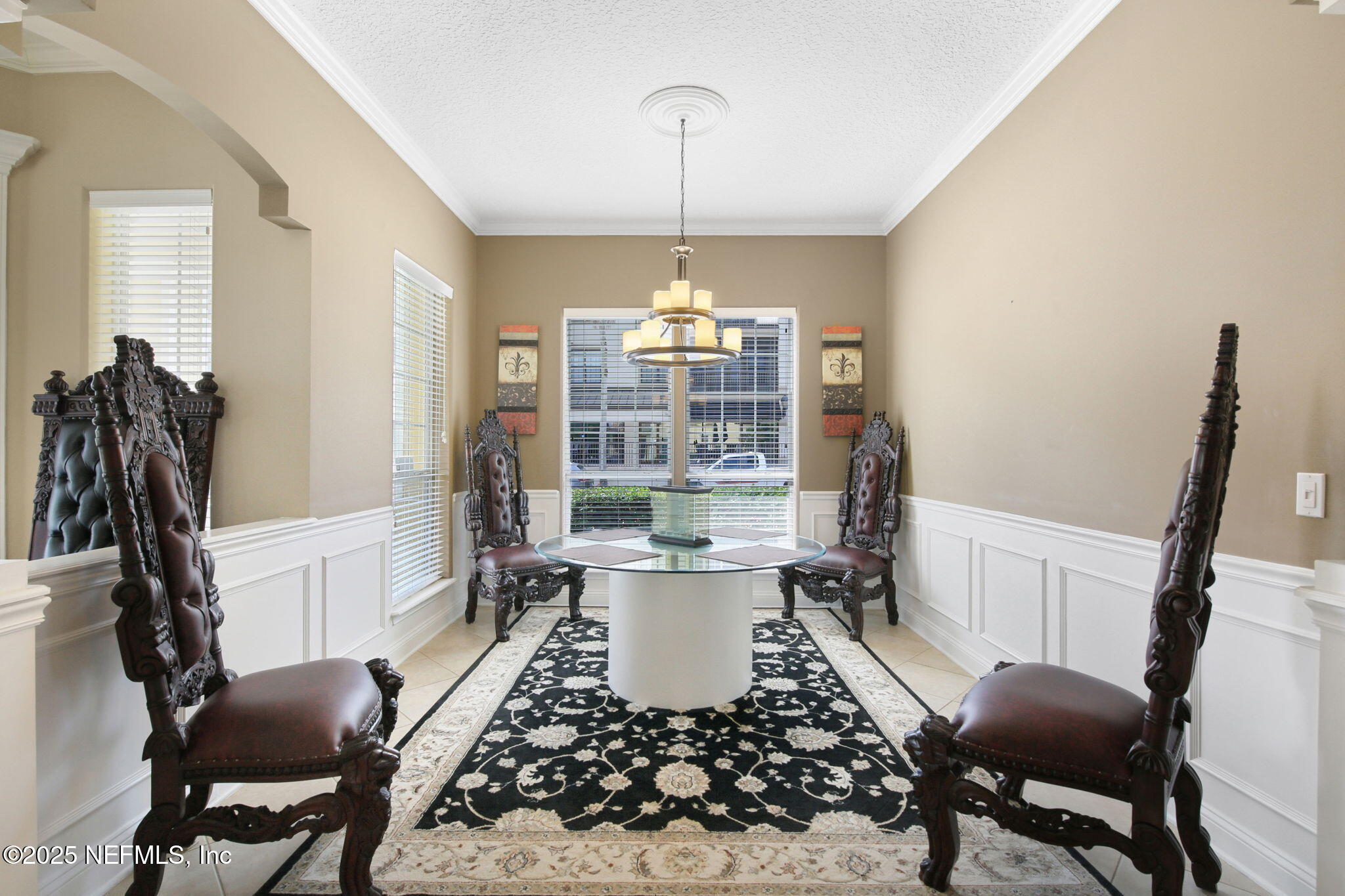 400 Central Street St. Augustine, FL 32095 - Photo 25 of 49 a living room with furniture a window and a chandelier